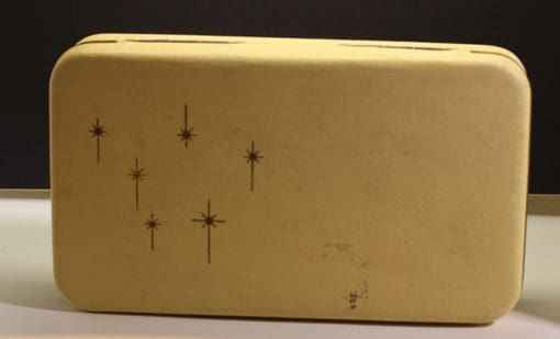 A yellow suitcase with stars on it.
